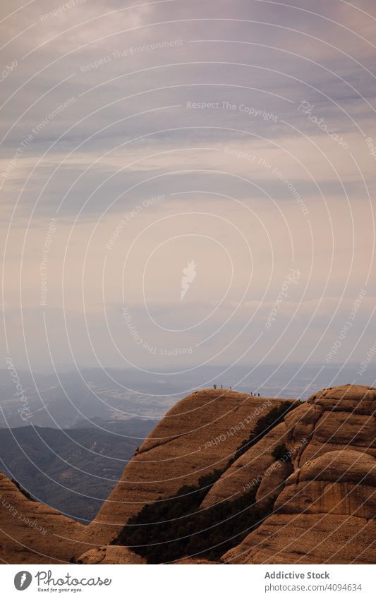 Climbers climbing the mountain of Montserrat, wild danger safety dangerous rocky trekking summer hiker extreme active hiking vertical adventure activity tourist