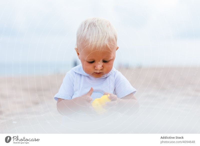 Baby boy playing with rubber ducks summer beach toys innocence happy little 5 months blond life little infancy childcare male newborn sweet caucasian infant