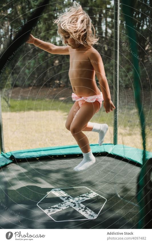 A Happy Young Baby Infant Jumping For Joy Stock Photo, Picture and