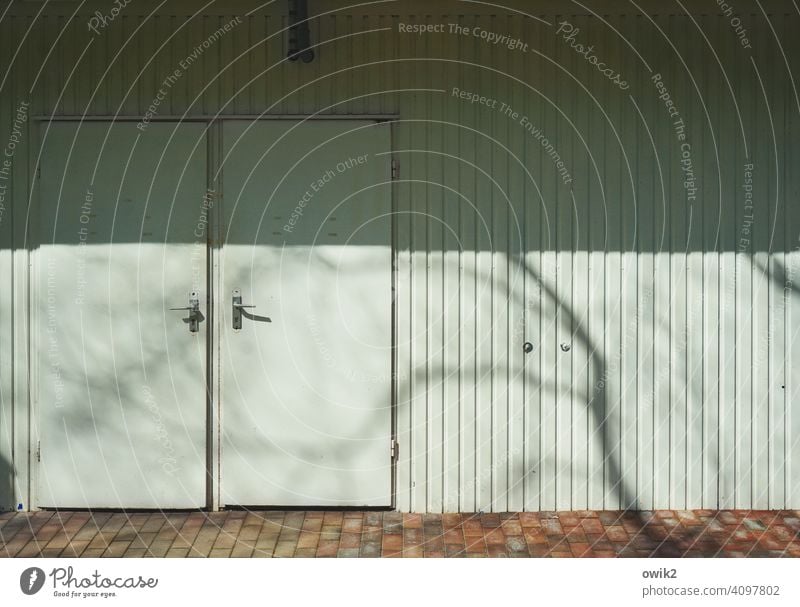 Door to door Closed too Building Exterior shot cordon Colour photo Day cordoned off Structures and shapes Detail Sunlight Shadow door handle Couple Entrance