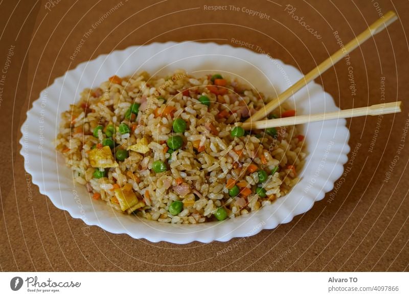 Delcious Special Fried rice in a white dish and Asian Chopsticks cooking sauce meat egg special china dinner plate cooked asian food stir fry spicy
