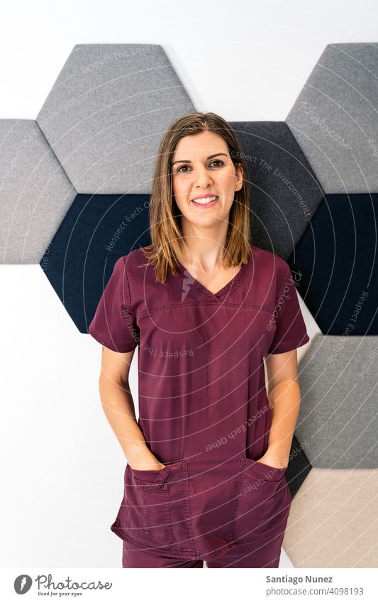 Female Dental Clinic Worker girl nurse woman female uniform work uniform dental clinic looking at camera smiling indoors background portrait work clothes alone