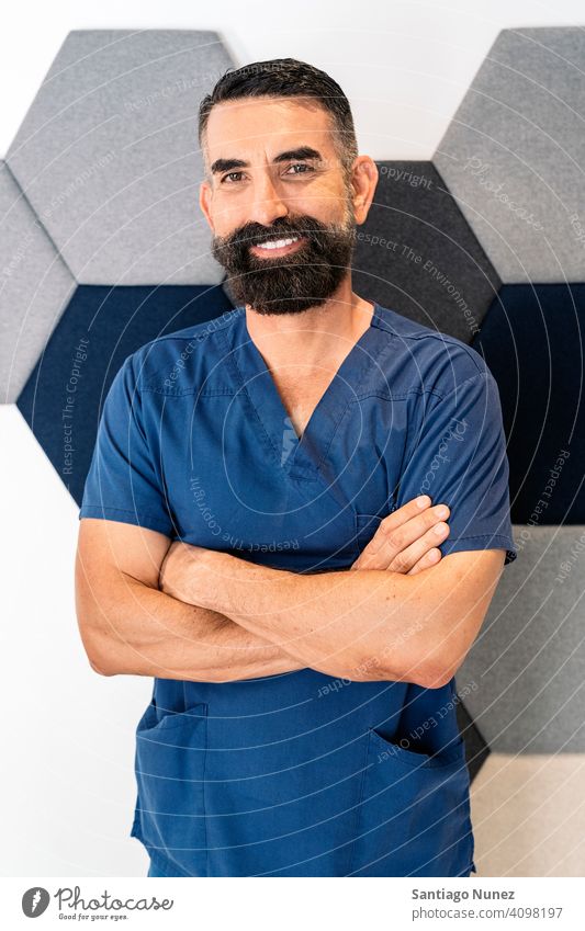 Male Dental Clinic Worker bearded man male doctor work uniform dental clinic looking at camera smiling indoors background portrait work clothes alone one person