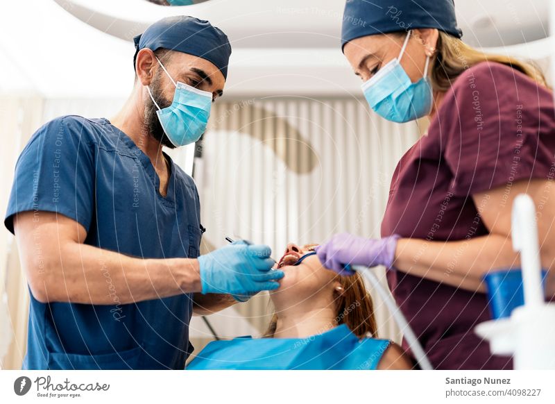 Patient During Dentist Visit man woman patient standing looking examining front view dentist clinic dental clinic lying health care equipment medicine medical