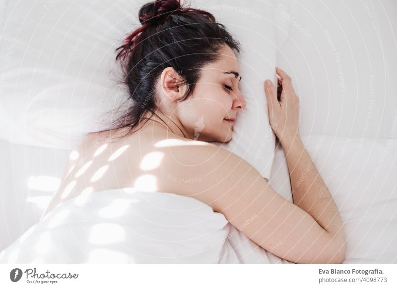 Above View Of Relaxed Woman Sleeping In Bed At Night Stock Photo