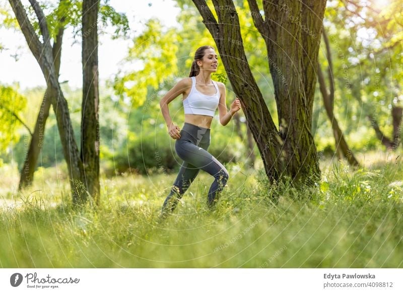 Fitness Woman Exercising Outdoors Stock Photo - Download Image Now - Women,  Running, Exercising - iStock