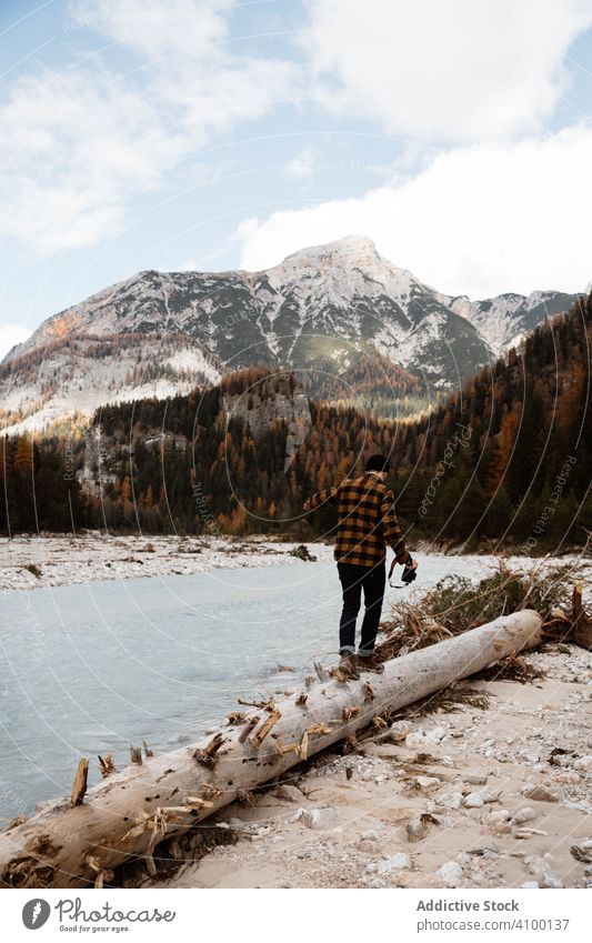 Man delighting in views near lake and mountains tourism water boat fog cloudy mist travel landscape vacation adventure nature beautiful sky scenic holiday rock