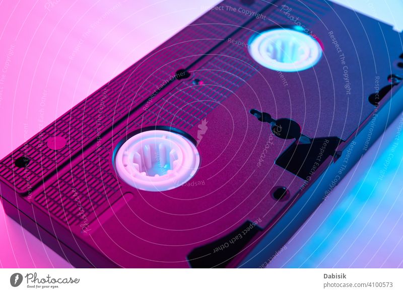 Video cassete on the color background. Retro vhs cassette tape video retro vintage neon computer fashion design frame party icon technology plastic old movie