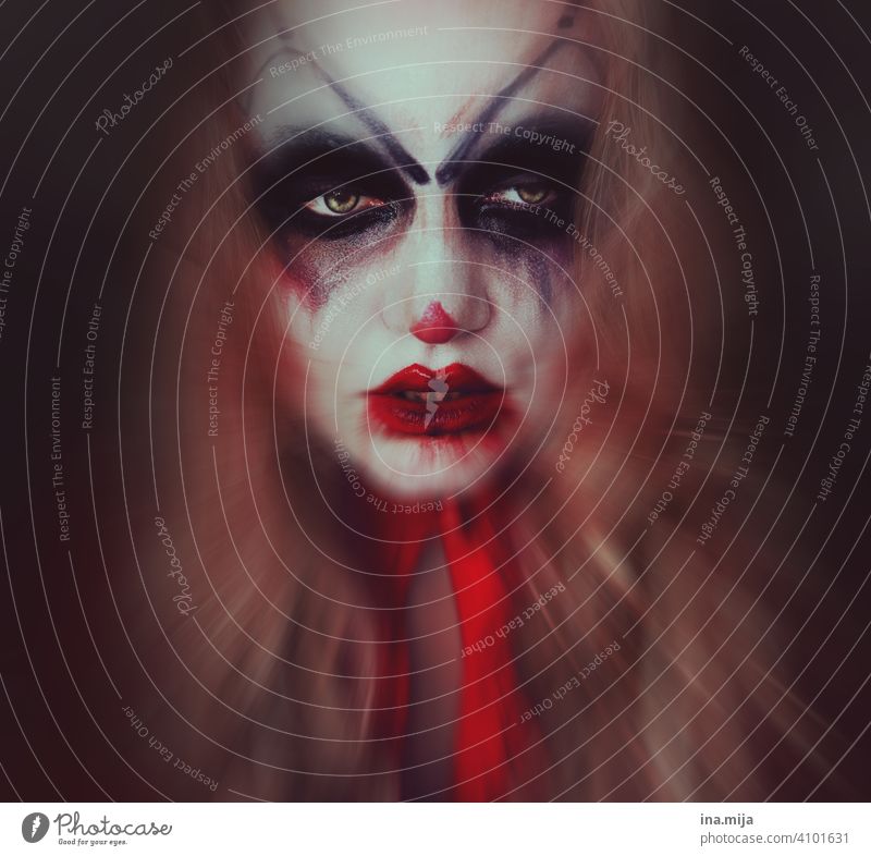The clown behind the mask Clown Creepy creepy clown Fear Face Hallowe'en Make-up Threat Circus portrait Mask Carnival Looking Eerie spooky Human being Adults