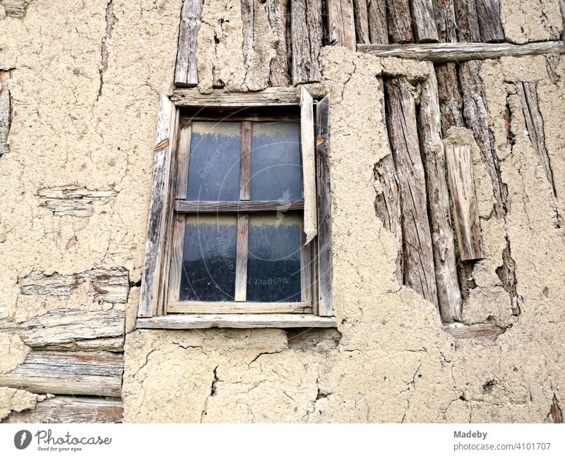 Old wooden house with mullioned windows and crumbling plaster in the old town of Tarakli near Adapazari in the province of Sakarya in Turkey Window