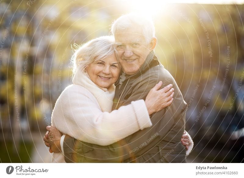 Free Photos - A Man And A Woman, Likely An Older Couple, Standing Next To  Each Other And Posing For A Picture In A City Setting. They Are Both  Wearing Coats, Possibly