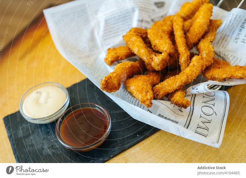 Breaded chicken sticks with dipping sauces breaded fried food dish delicious cook cooked ingredient meal portion home tasty lunch gourmet fresh day table junk