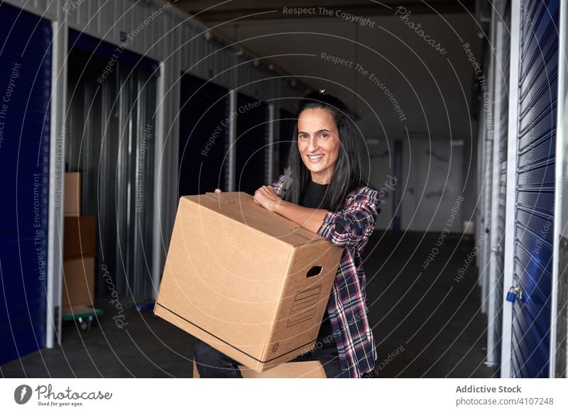 Woman with cardboard boxes woman package pretty delivery beautiful lifestyle holding opening receive packaging happy female container post parcel postal