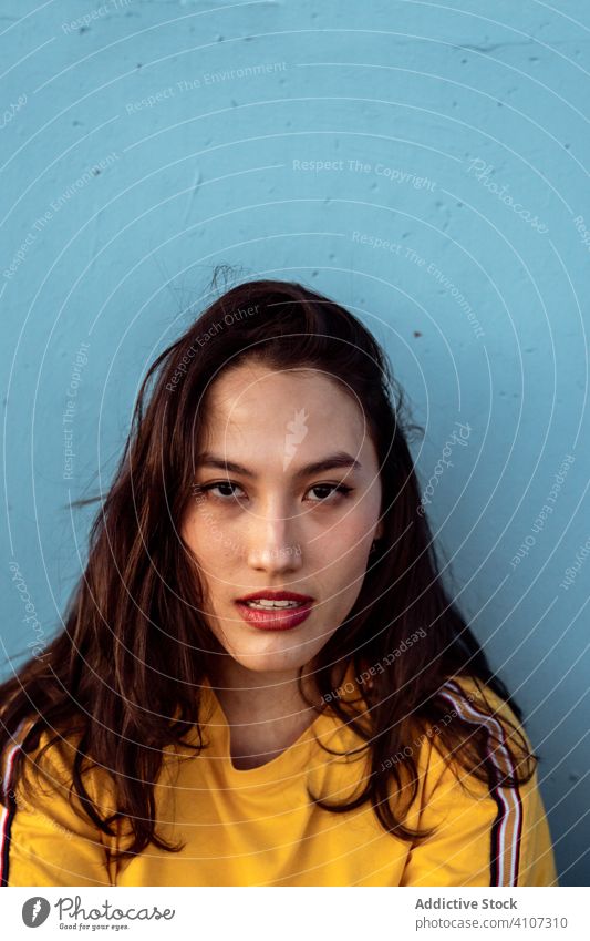 Young woman looking at camera with attentive and sorrowful eyes portrait young unhappy dissapointed tired sad black jumper female lonely concerned despair