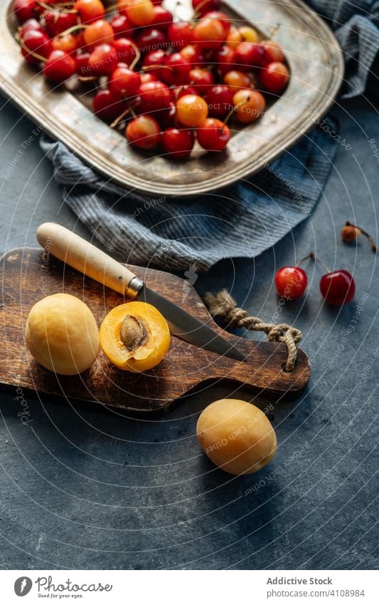 Peaches And Exotic Flower In Modern Fruit Bowl High-Res Stock