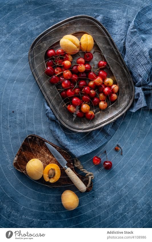 Cherry and peach on plate fruit cherry arrangement colors studio exotic sweet composition healthy minimalist fresh dessert delicious vitamin juicy freshness