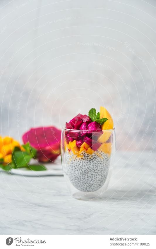 Delicious fruit dessert in glass pudding super food clean eating restaurant chia pitaya colorful red mango mint dish fresh delicious high cuisine exotic