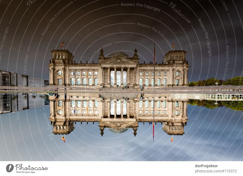 Reichstag in the reflection of a puddle I Central perspective Reflection Shadow Copy Space top Twilight Artificial light Light Copy Space right Copy Space left