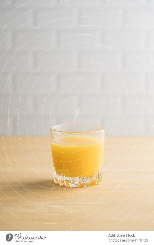 Orange juice in glass on table orange fresh vegan dried kitchen summer vitamin fruit citrus exotic mix ripe healthy drink beverage natural organic vegetarian