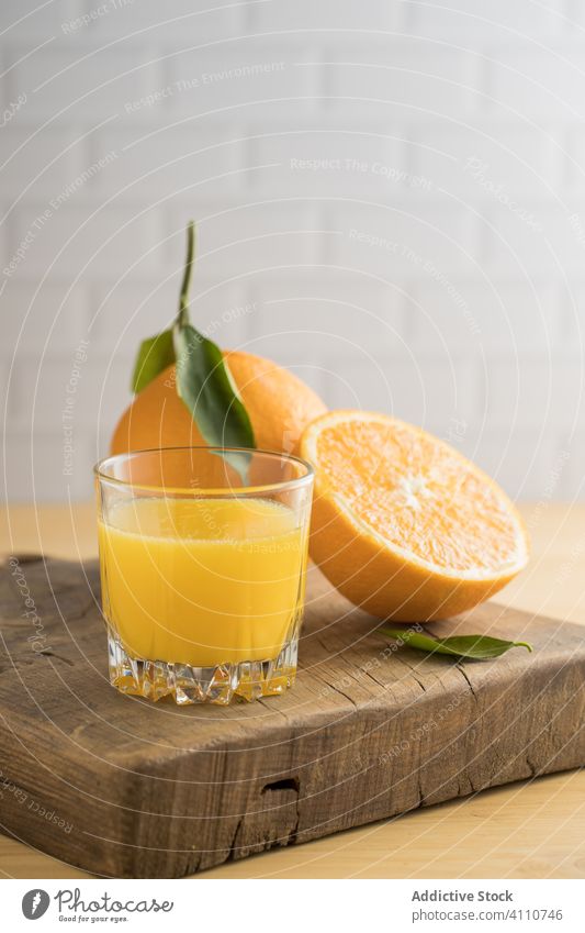 Orange juice in glass on table orange fresh vegan jar kitchen summer vitamin fruit citrus exotic ripe healthy drink beverage natural organic vegetarian diet