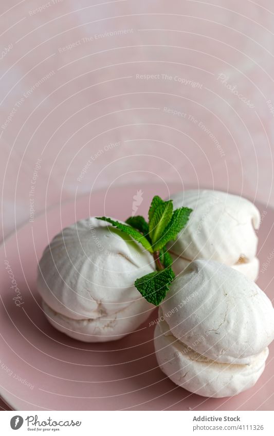 Russian traditional zefir dessert with mint russian food sweet background zephyr sugar homemade soft white delicious meringue souffle cream airy vanilla tasty