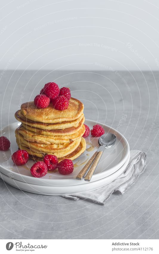 Delicious pancakes with fresh raspberries raspberry plate spoon dessert breakfast morning delicious sweet food tasty pastry gourmet ripe yummy homemade snack