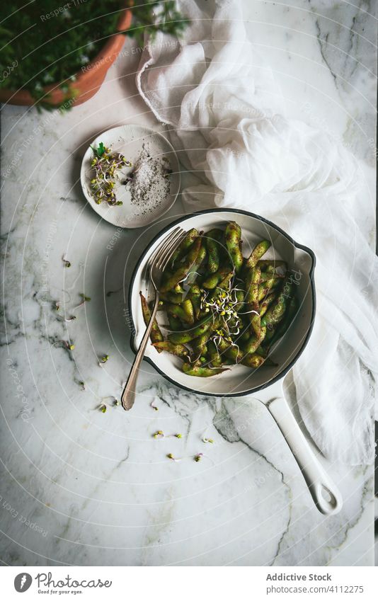 Bowl with edamame dish on table soybean bowl napkin food asian tradition delicious fresh gourmet meal cuisine seasoning tasty healthy vegetable vegetarian vegan