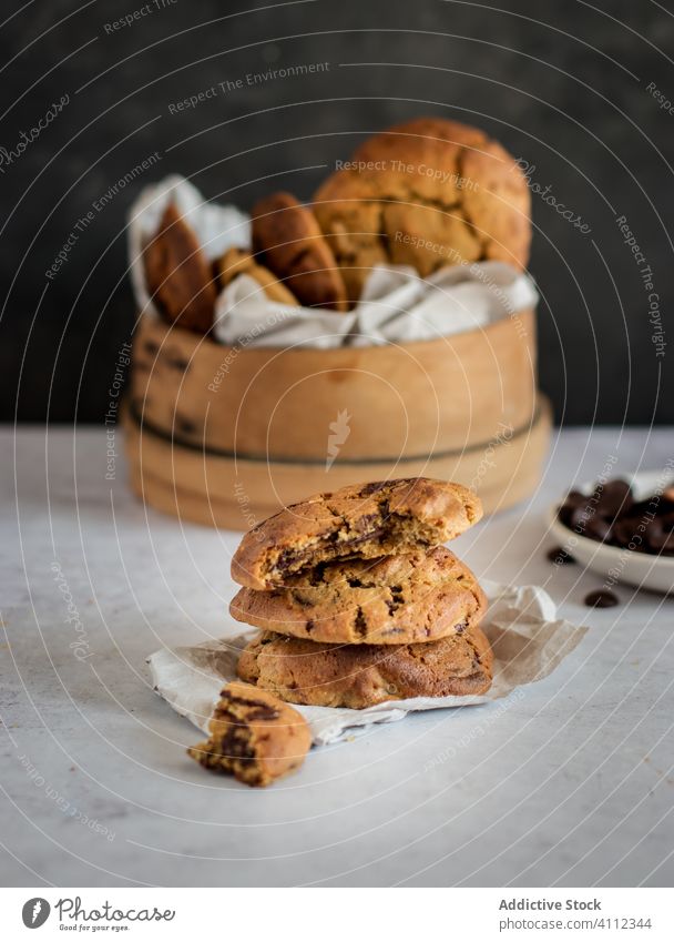 Homemade sweet biscuits on table cookie chocolate chip bite homemade food baked stack tasty delicious fresh cuisine meal bowl dessert pastry piece rustic pile