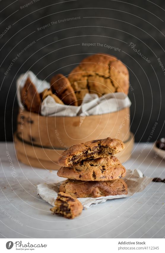 Homemade sweet biscuits on table cookie chocolate chip bite homemade food baked stack tasty delicious fresh cuisine meal bowl dessert pastry piece rustic pile