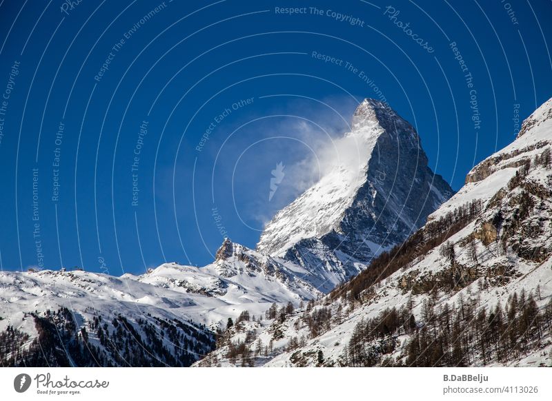 The Matterhorn rises above Zermatt.  At 4478m, it is one of the highest mountains in the Alps and one of the most famous mountains in the world because of its striking shape.