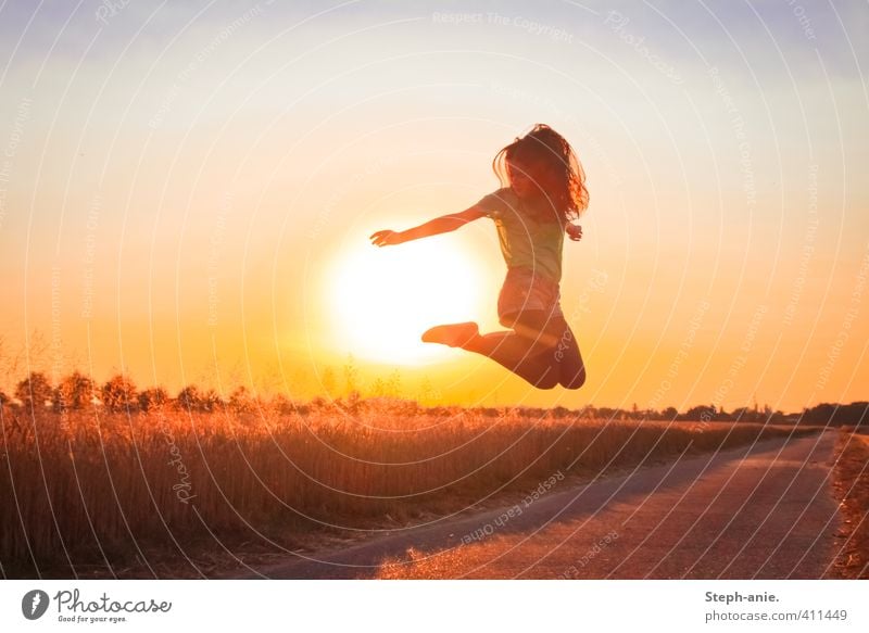 Sunset jumper Feminine Young woman Youth (Young adults) 1 Human being Sky Sunrise Sunlight Summer Beautiful weather Field Movement Jump Illuminate Happiness