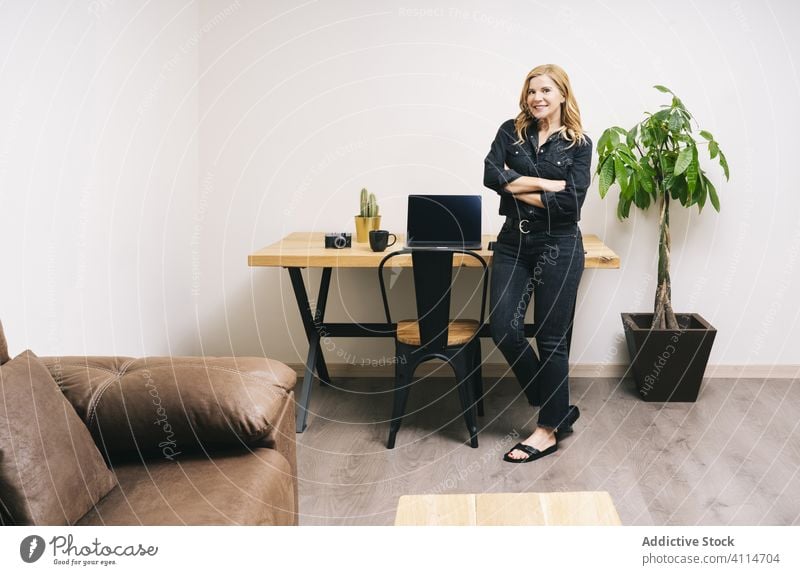 Woman working from her studio office at home woman desk computer business adult laptop caucasian businesswoman internet happy home-office indoors pretty