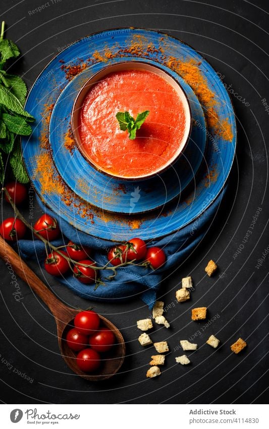 Homemade tomato soup with bread, mint and olive oil healthy food lunch tasty background nutrition vegan food traditional gourmet homemade spoon fresh