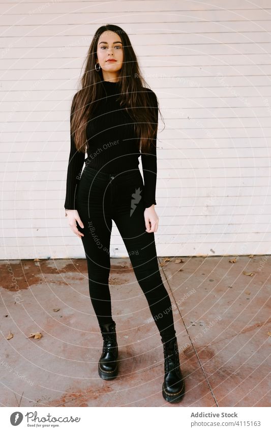 Fotografia do Stock: Beautiful brunette girl in black leggings and