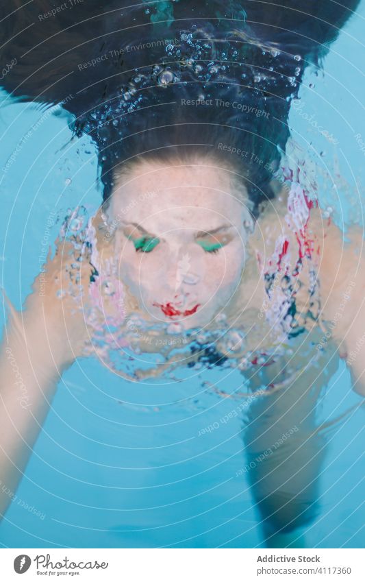 close-up of a brunette girl with long hair on a stairs in the pool water blue leisure teenager young female woman person summer fun people beautiful smile swim