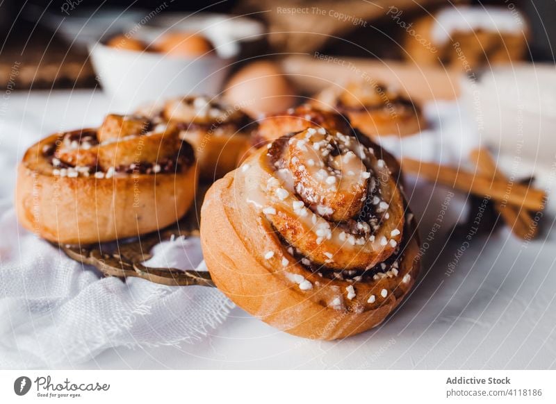 Baked cinnamon buns with sweet icing roll dessert cook delicious food glaze dish sugar homemade baked gourmet arrangement confectionery topping cuisine