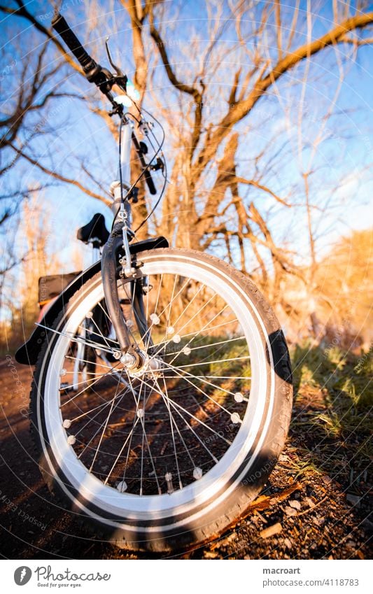 bicycle tour Bicycle Tire Bicycle tyre Handlebars Steering wheel Nature Evening sun out activity outdoor Wide angle Fisheye Spokes Oldschool Retro folding bike