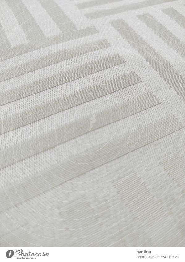 Satin and elegant creamy tablecloth textile clean white luxury wealth texture textured satin satiny lines composition pattern gradient silver pearl ivory color
