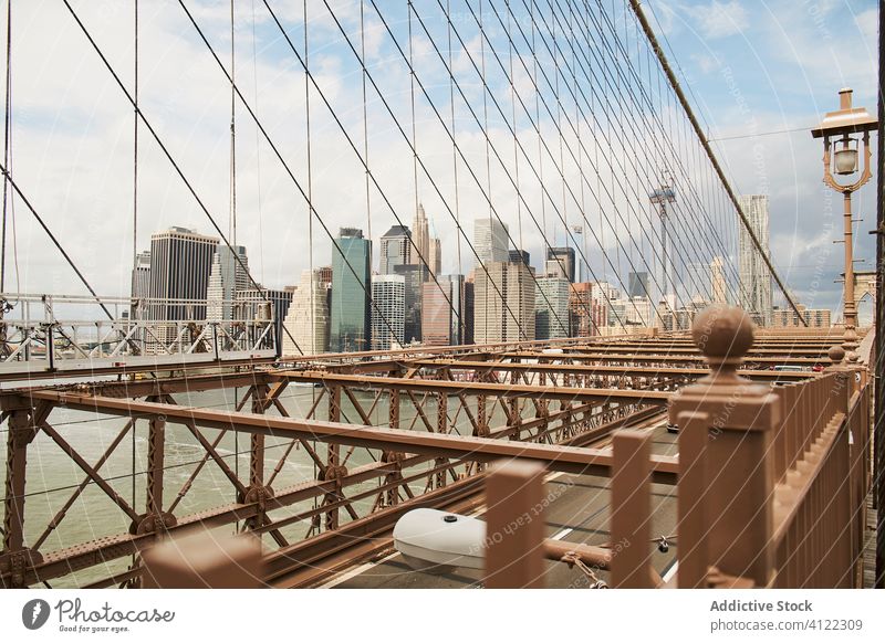 Modern city seen from bridge skyscraper building cityscape new york brooklyn architecture skyline cable river suspension usa america street tower travel