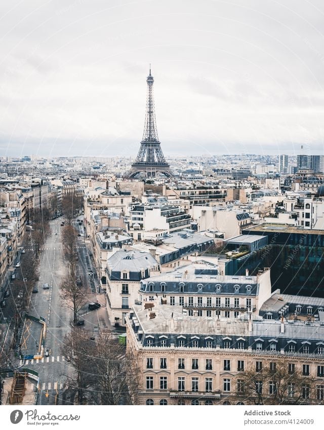 View of Eiffel Tower on street in Paris eiffel tower paris landmark famous sightseeing old symbol city travel bright tall amazing sky facade urban exterior