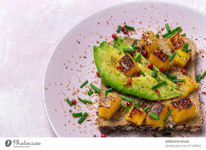 Homemade toasted bread with avocado, mango and aromatic herbs food sandwich healthy lunch snack breakfast meal gourmet vegetarian delicious background slice