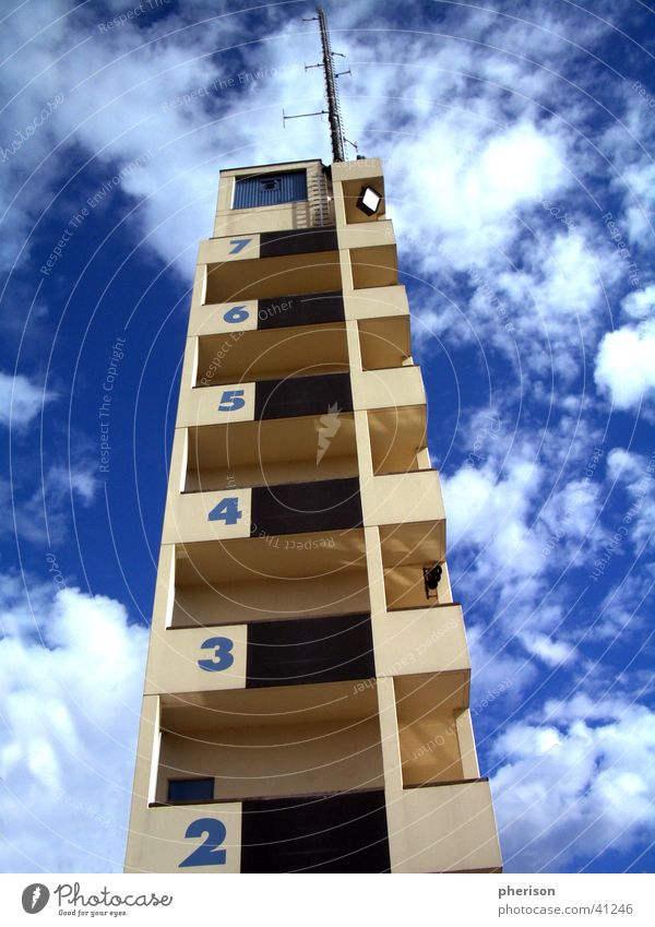 cloud tower House (Residential Structure) Clouds Antenna Digits and numbers Story Architecture Tower Blue Sky Tall Fire department