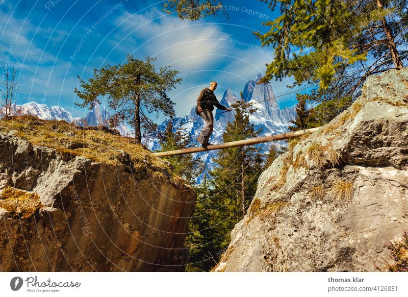 A man walks over a rope bridge Hiking outdoor hicking hike Exterior shot Mountain Vacation & Travel Colour photo Hiking trip hikers Adventure Tourism