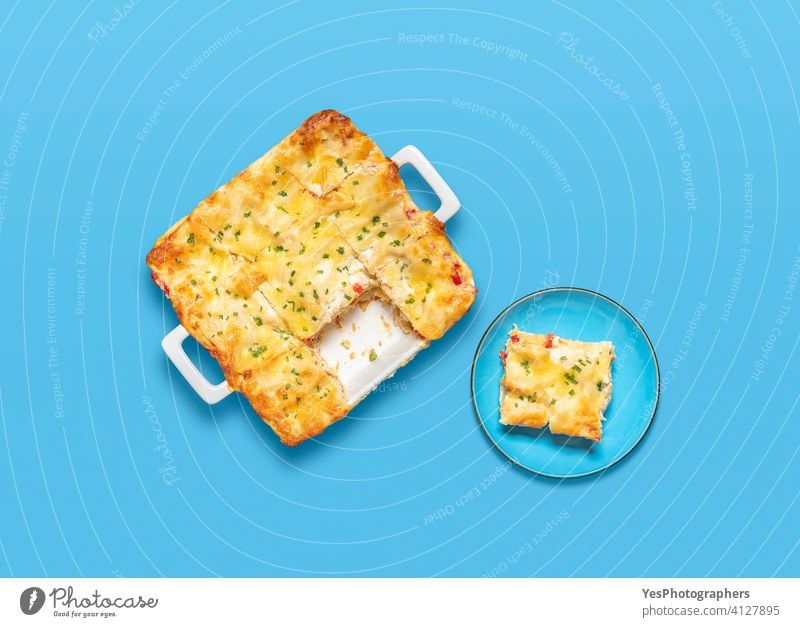 Vegetarian lasagna top view on a blue background. above view bechamel sauce cheese colorful cuisine cut out delicious dinner dish flat lay food fresh gourmet