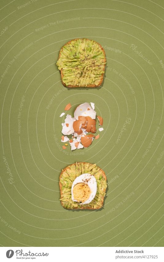 Avocado and boiled eggs toast avocado guacamole fruit food green healthy pop minimal breakfast bread vegetarian veggie cool still life tasty top view from above