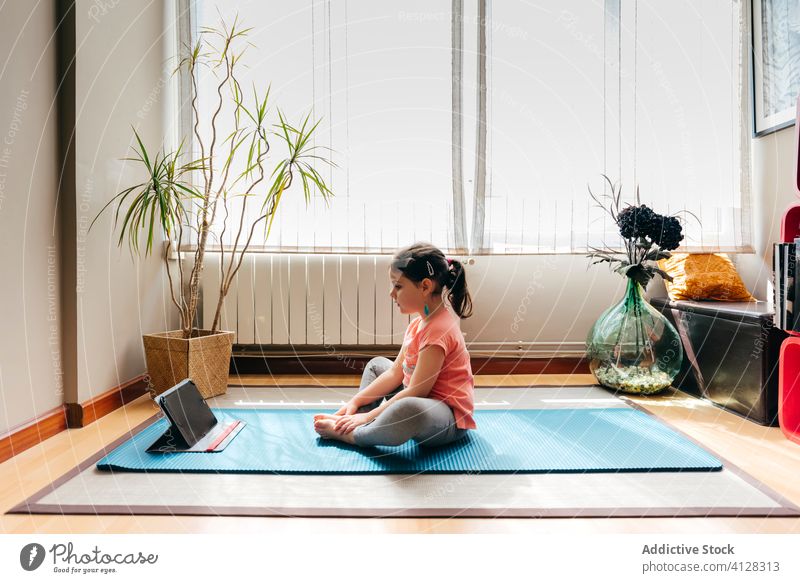 Barefoot girl doing meditation in cozy room at home - a Royalty Free Stock  Photo from Photocase