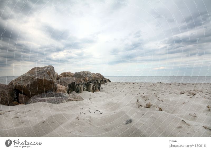 Heap formation stones Sand Beach Baltic Sea Ocean Water Horizon Sky Relaxation Clouds Uneven Surface Break water breakwater Boulders coast Covered