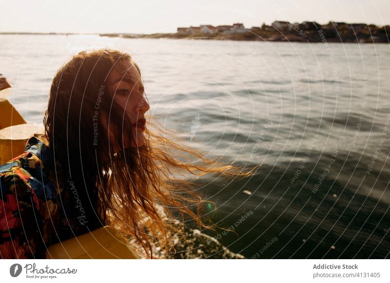 Free Photo  Young woman enjoying the ocean breeze