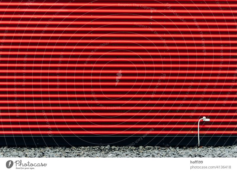 red striped facade with white grounding cable Red Striped Corrugated iron wall with red stripes Wall (building) red facade Facade Minimalistic