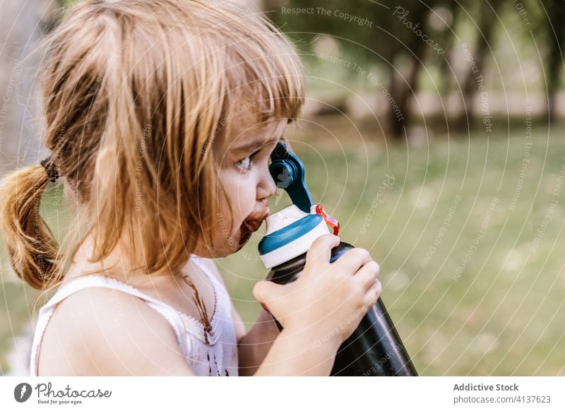 Little girl drinking mineral water bottle. Stock Photo by ©Gustavo_Andrade  15773603